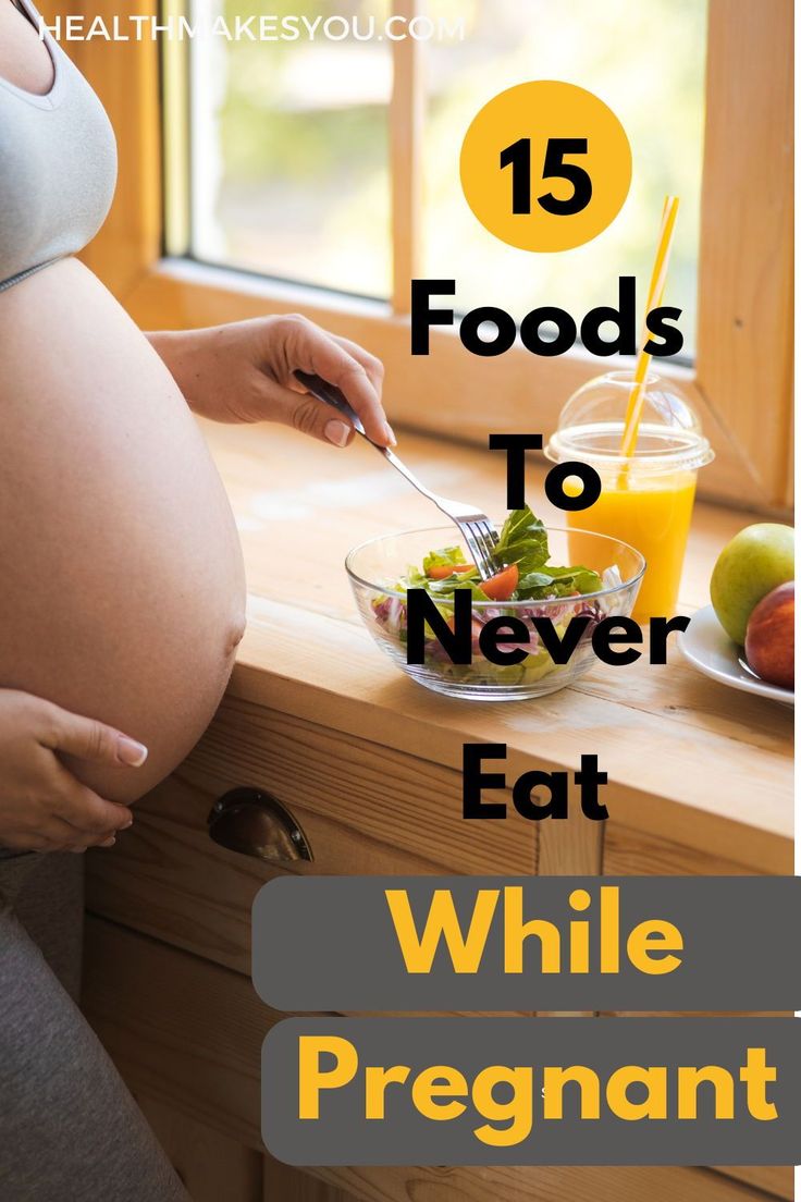 the pregnant woman is eating her food on the counter