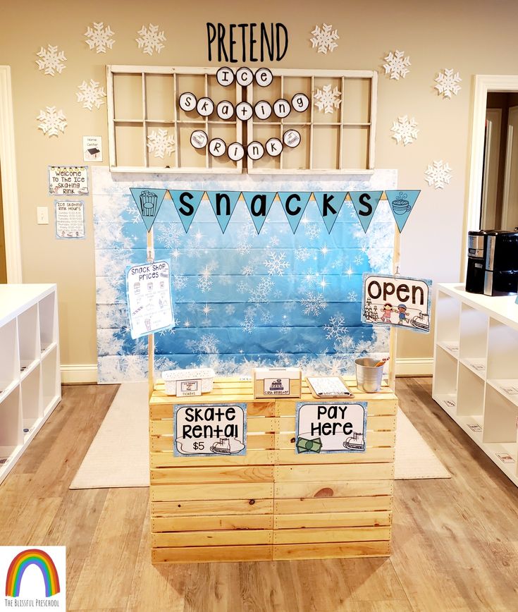 an ice cream stand in a store decorated with snowflakes