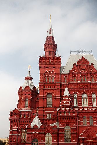 a large red building with two clocks on it's sides