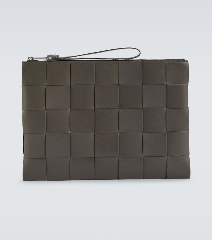 This zipped pouch from Bottega Veneta is crafted from leather in an Intrecciato weave featuring a removable wristlet, has a lined leather interior, and comes in light graphite grey. Bottega Veneta Intrecciato, Leather Pouch, Curator Style, Leather Interior, Travel Accessories, Bottega Veneta, Louis Vuitton Damier, Bag Accessories, Mens Accessories