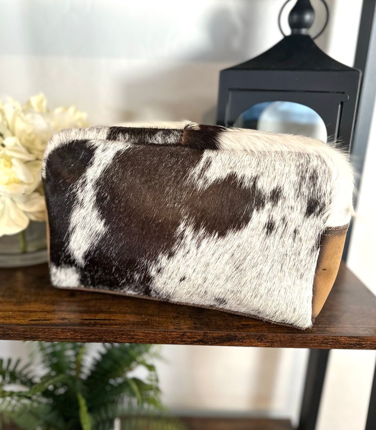 Western Cowhide and leather travel shave, cosmetic, toiletries or accessories bag. 11” W x 7” H x 3” D zips closed, small zipper pocket inside (large size, fits a lot of items) select cowhide option from drop-down menumade by American Darling - not Customizable Cowhide Bucket Purse, Cowhide Makeup Bag, Cow Hide Purses, Western Purses And Handbags Fabric, Western Cowhide Purse, Accessories Bag, Leather Travel Bag, Saddle Pads, Purse Strap