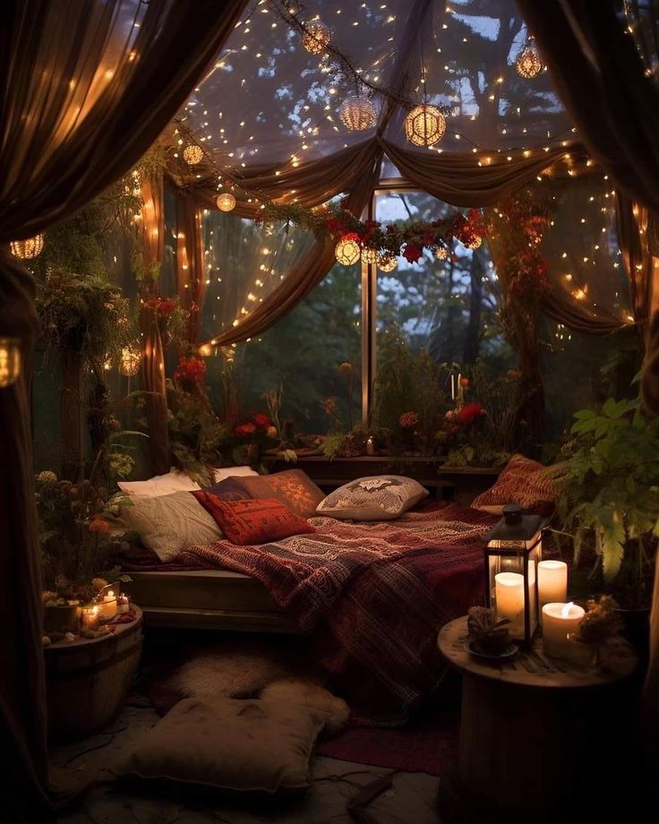 a bed with lights in the middle of it and some plants on the other side