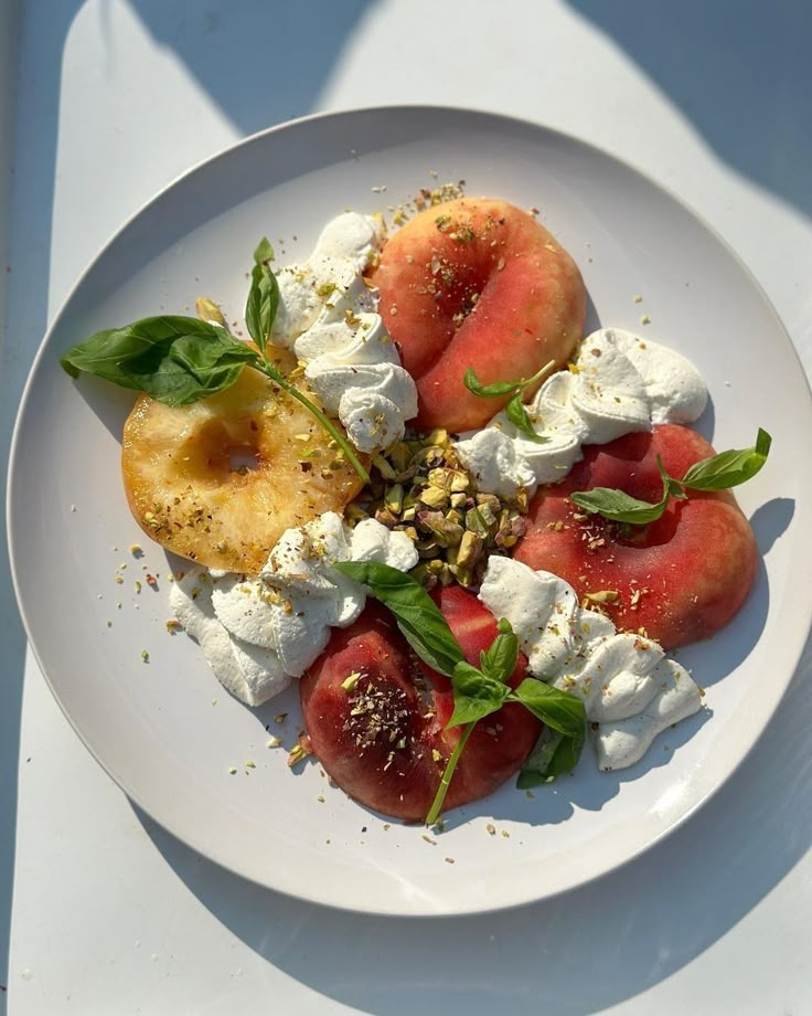 a white plate topped with watermelon and feta