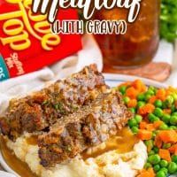 meatloaf with gravy and peas on a plate next to a bag of mashed potatoes