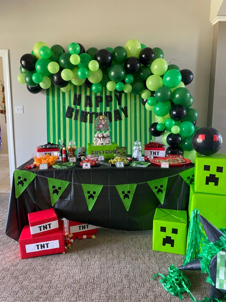 a party with green and black decorations