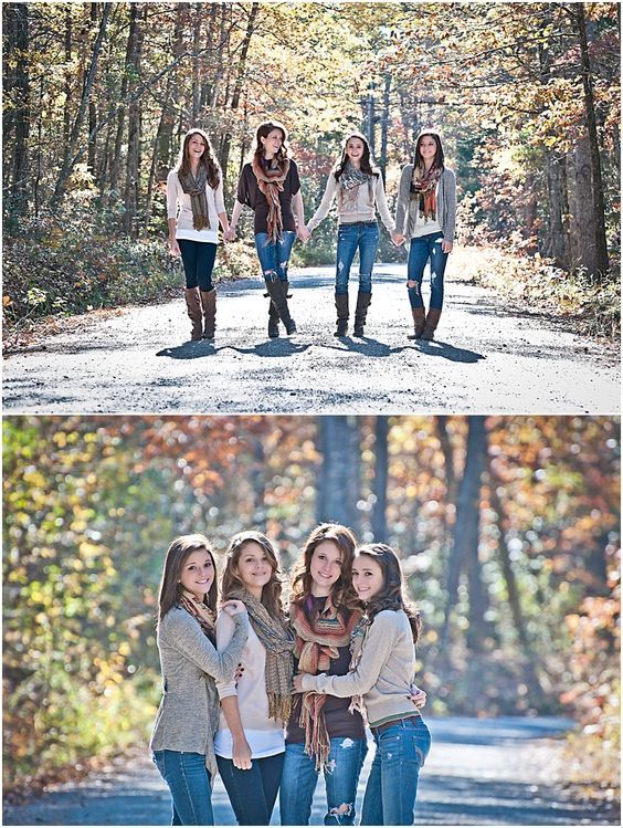 four girls standing in the middle of a road