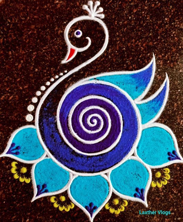 a peacock painted on the ground with blue flowers