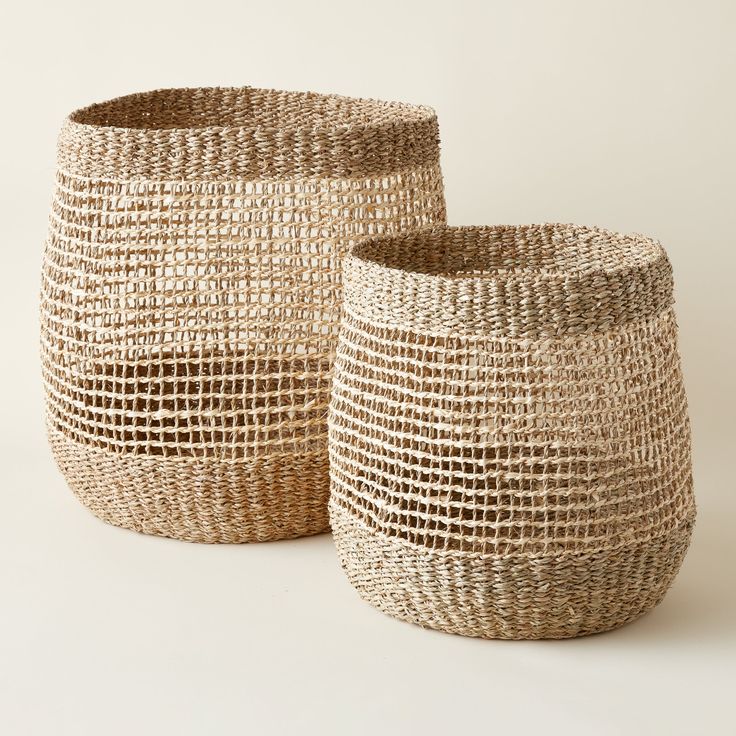 two woven baskets sitting next to each other