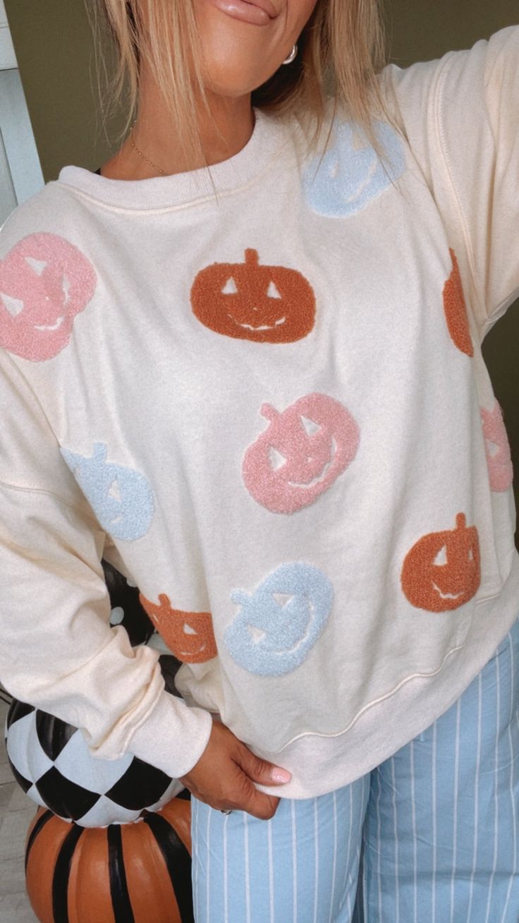 Stay cozy this fall in our Oversized Pumpkin Embroidered Sweater! This sweater is perfect for those chilly fall days - the embroidered design adds a touch of charm to you look, making this a MUST have this season! Pumpkin Sweater Fall pastel pumpkins Oversized sweater Ivory Trendy fall sweater Fabric: 60% Cotton - 40% Polyester Measurements/Sizing: (Approximate. Measured lying flat.) S- Bust 50" Length 23 1/2" M-Bust 52" Length 24" L- Bust 54" Length 24 1/2" Model Specs: Karli is wearing a size small in the photo.How will this item fit you? Check out our MODEL SPECS (Typical Sizing - Karli: S-Size 5/26 - 5ft 2in, Emily: S-Size 3/25 - 5ft 5in, Syd: L/XL- Size 15/ - 5ft 8in)Need help with sizing? No problem! Join our VIP group on Facebook, Everyday Chic Boutique VIP Insiders to chat directly Cozy Long Sleeve Sweater With Floral Embroidery, Casual Embroidered Sweater For Fall, Cute Floral Embroidery Fall Tops, Cute Cream Sweatshirt For Fall, Cream Sweater With Floral Embroidery For Fall, Embroidered Crew Neck Sweater For Fall, Cute Floral Embroidered Sweater For Fall, Cute Floral Embroidery Sweater For Fall, Oversized Embroidered White Sweater