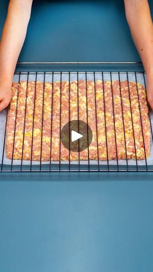 someone is cooking pizzas on an outdoor grill with the video showing how to cook them