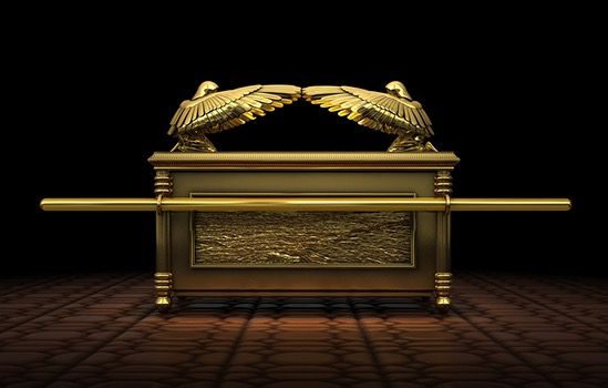 an image of a golden casket with two birds on top