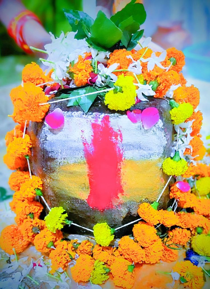 a cake decorated with orange and yellow flowers