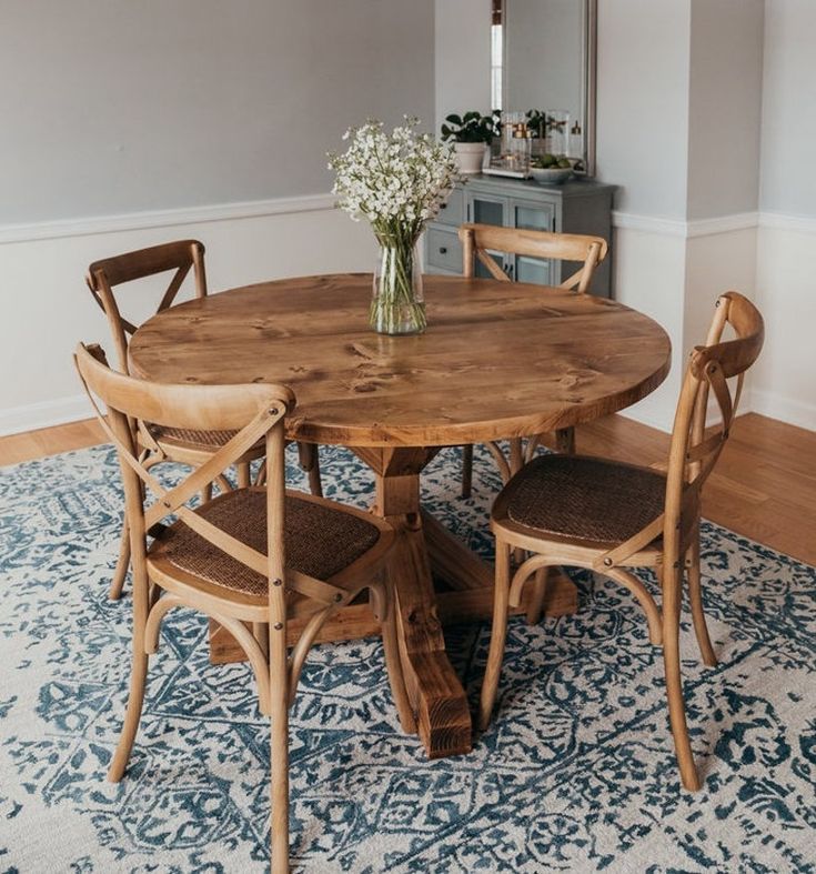 a wooden table and chairs in a room