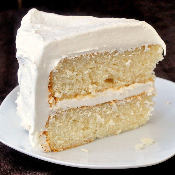 a slice of white velvet cake on a plate