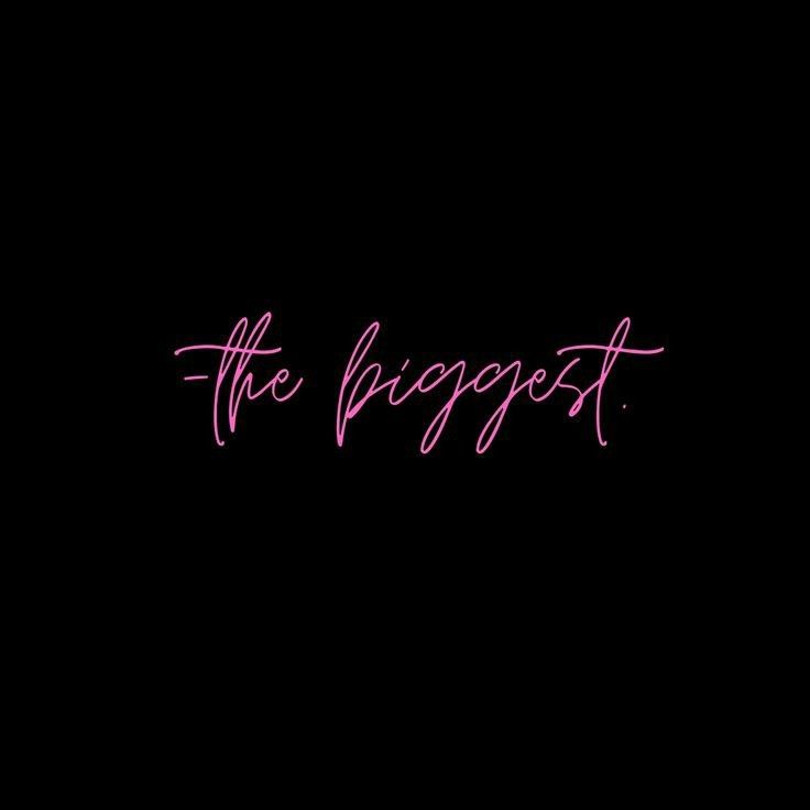 the word the biggest written in pink on a black background