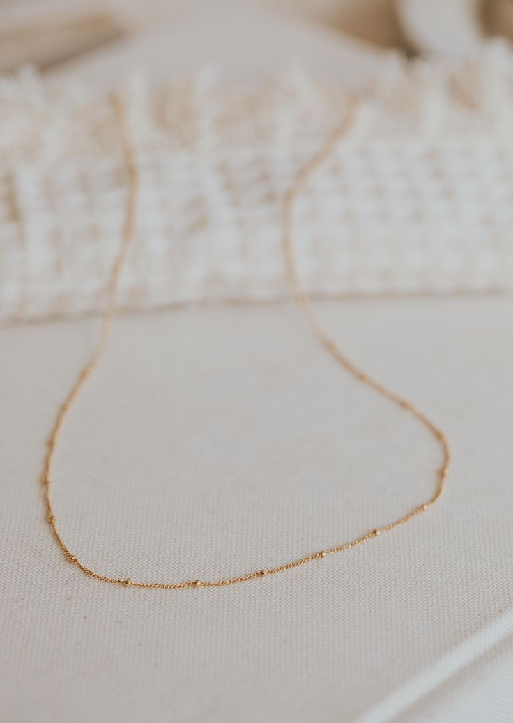 A sweet + delicate layering chain. Offered in 16", 18" or 20" lengths. Available in 14kt Gold Fill + Sterling Silver. Our jewelry is handmade so each piece will be unique and may vary slightly from what is pictured. Dainty Yellow Gold Station Necklace With Satellite Chain, Dainty Everyday Satellite Chain Necklace, Dainty 14k Gold-filled Satellite Chain Necklace, Delicate Everyday Satellite Chain Necklaces, Dainty Cable Chain Necklace, Delicate 14k Gold Filled Necklaces With Delicate Chain, Dainty Station Necklace With Satellite Chain As Gift, Dainty 14k Gold Charm Necklaces With Gold Chain, Simple 14k Gold-filled Necklace With Delicate Chain