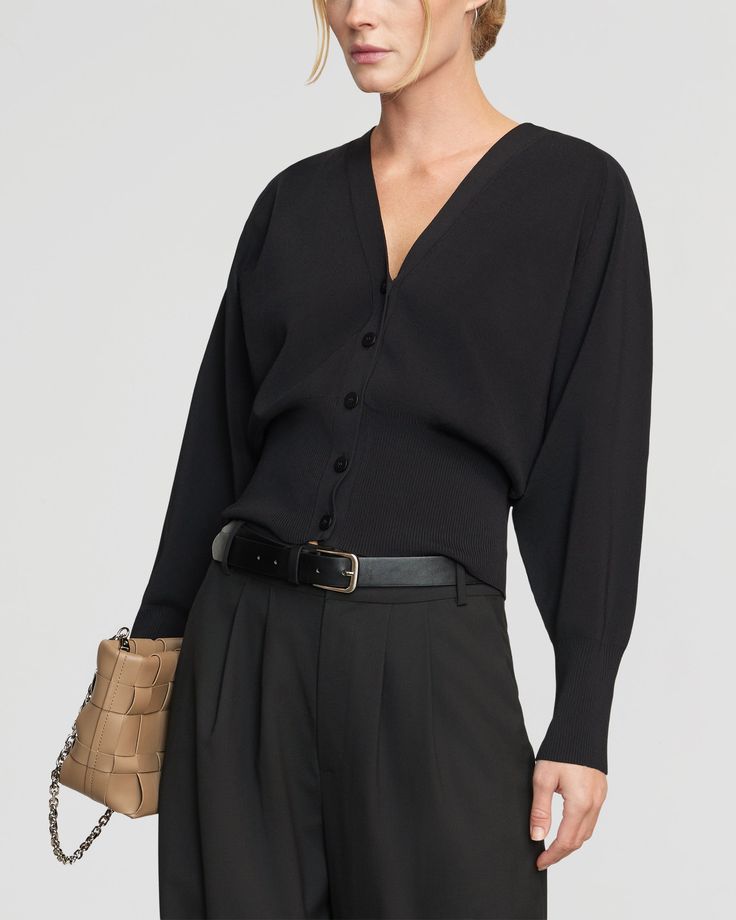 Effortlessly chic and versatile, this modern take on the classic button-front cardigan is a no-brainer addition to your wardrobe. We love to style Carson buttoned up as a top, or layered and open over a tank. See below for our general Size Guide and available measurements Made of 50% viscose, 28% nylon, and 22% spandex Handwash with like colors and lay flat to dry Button Front Cardigan, Black Xs, Black Cardigan, Lay Flat, Size Guide, Button Up, Spandex, Wardrobe, Black