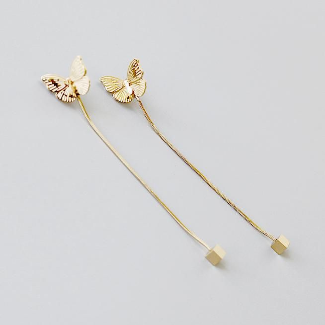 These elegant earrings feature highly polished butterfly creating a trendy effect on a classic earring. Material: 316L Stainless Steel, 18k Gold Plated Size: Chain: 6.5cm Butterfly: 1.4x1.1cm Origin: California, USA Made of 18K Gold plated Stainless Steel for a long life, these earrings have a glam high-polish finish and are hypoallergenic for the benefit of those with sensitive skin. It is the perfect anniversary and birthday gift for her. Material Our earrings are made from the top-grade 316L Elegant Metal Threader Earrings As Gift, Elegant Butterfly Jewelry For Evening, Elegant Butterfly Jewelry For Parties, Gold Butterfly Jewelry For Party, Gold Earrings With Butterfly Charm For Formal Events, Elegant Butterfly Earrings For Formal Occasions, Gold Earrings With Butterfly Charm For Party, Gold Butterfly Earrings For Wedding, Elegant Metal Jewelry With Butterfly Shape