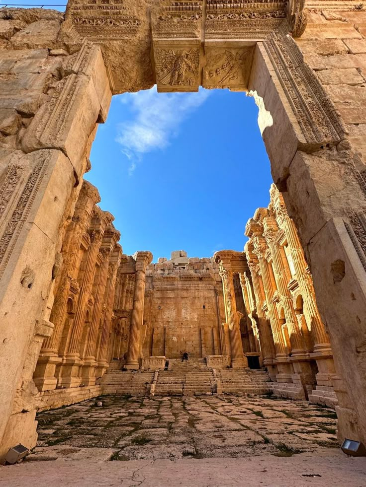 an arch in the middle of a stone building