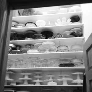 an open refrigerator filled with lots of different kinds of plates and bowls on it's shelves