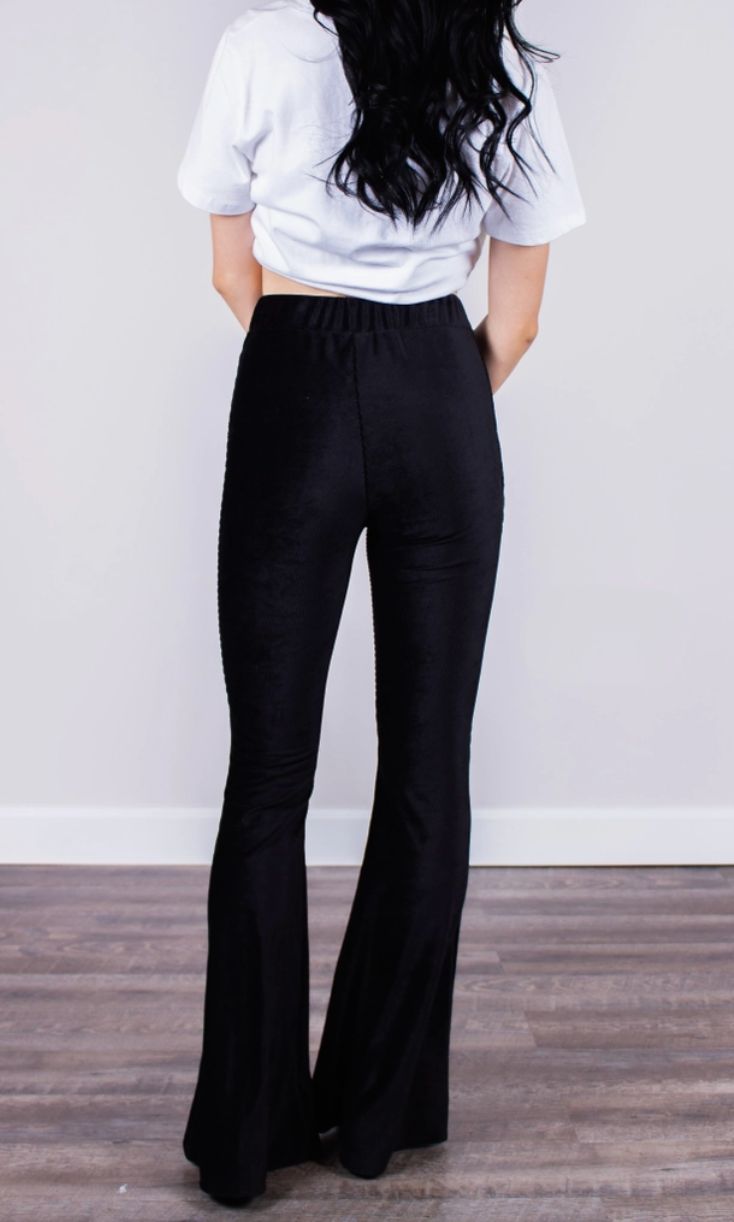 Fitted black high-rise corduroy pant with a bell bottom silhouette. Fits true to size. Stretch Flare Corduroy Bottoms, Stretch Corduroy Flare Bottoms, Casual Stretch Velvet Bottoms, Chic Black Velvet Pants, Flared Velvet Bottoms, Black Fitted Velvet Pants, Fitted Black Velvet Pants, Stretch Velvet Flare Bottoms, Black Velvet Bottoms For Night Out