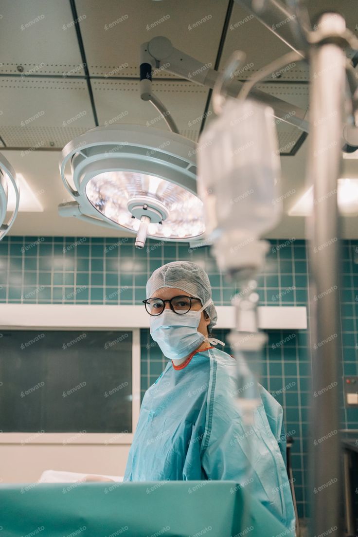 a surgeon is in the operating room with surgical equipment