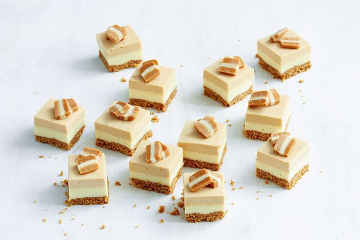 several pieces of cake sitting on top of a white countertop next to each other