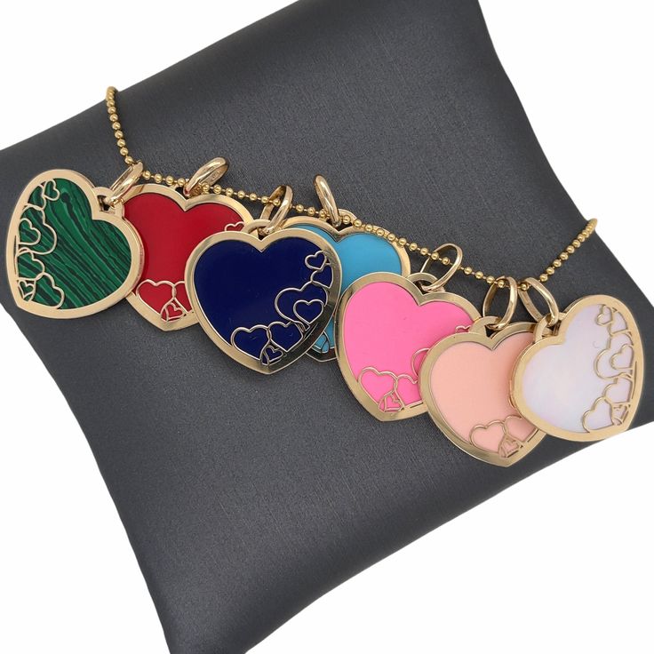 𝓦𝓮𝓵𝓬𝓸𝓶𝓮 𝓽𝓸 𝓛𝓲𝓸𝓷𝓱𝓮𝓪𝓻𝓽 𝓳𝓮𝔀𝓮𝓵𝓻𝔂 𝓢𝓱𝓸𝓹 ♥ Lovely Inlay Gemstone Padlock Heart Charms crafted in 14K Italian Gold with the choice of Red Coral, Peach Coral, Pink Paste, Lapis, Mother of Pearl, Turquoise, or Malachite. This beautiful and delicately designed multiple hearts within a heart Charm, is perfect for anyone near and dear. The Chain in the pictures are not included and for display purposes only. Please allow 1-5 weeks for delivery. *Please check measurements below, i Luxury Heart-shaped Enamel Jewelry, Multicolor Heart Pendant Jewelry For Mother's Day, Multicolor Double Heart Jewelry For Valentine's Day, Multicolor Heart Cut Jewelry For Valentine's Day, Heart Cut Enamel Jewelry For Gifts, Valentine's Day Multicolor Double Heart Jewelry, Multicolor Heart Charm Jewelry For Mother's Day, Multicolor Double Heart Jewelry Gift, Multicolor Double Heart Jewelry For Gift