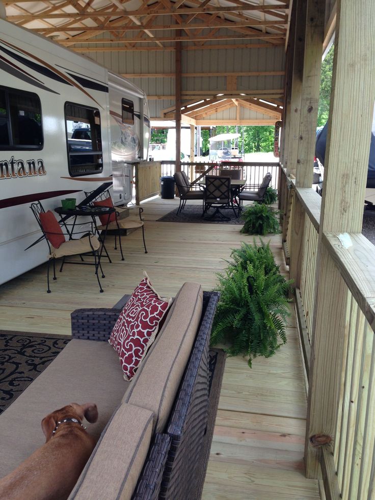 a dog laying on a couch in front of a covered porch