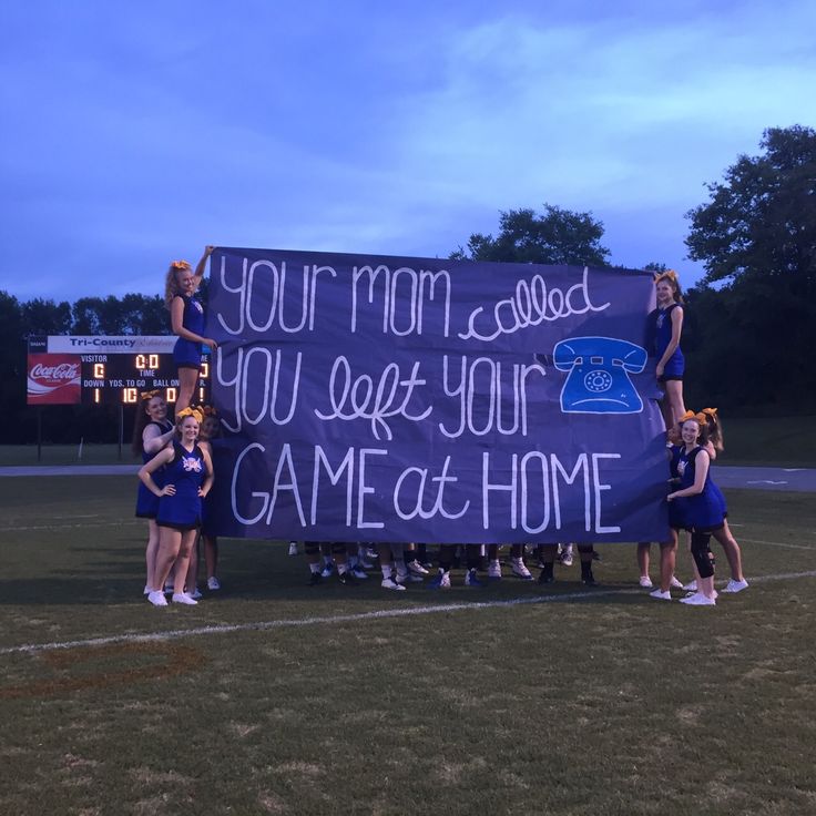 a group of cheerleaders holding up a sign that reads, your mom called you left your game at home