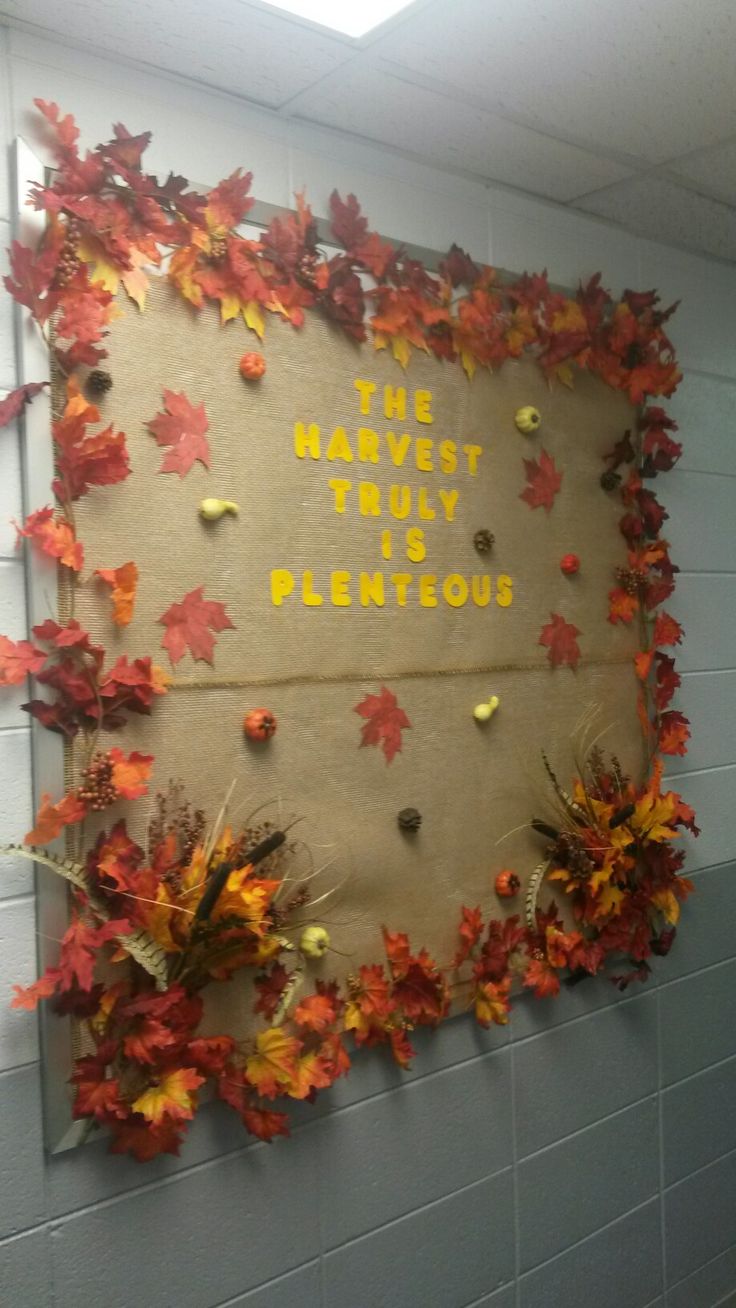 a bulletin board with autumn leaves on it and the words, the harvest try delicious