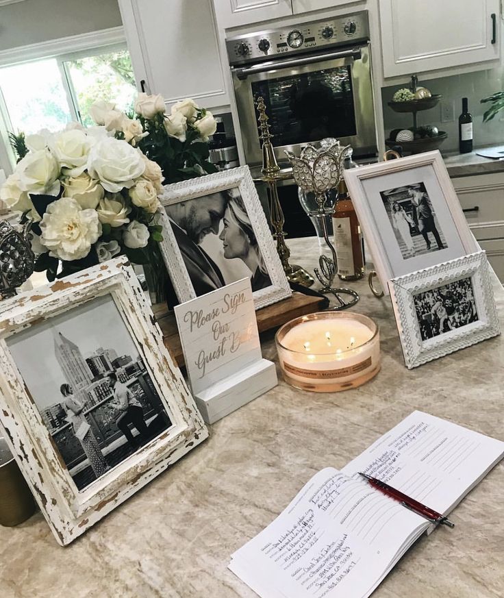 a kitchen counter topped with pictures and candles