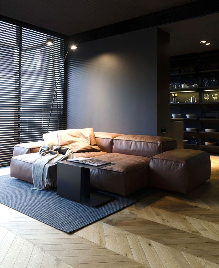 a living room filled with furniture and wooden floors