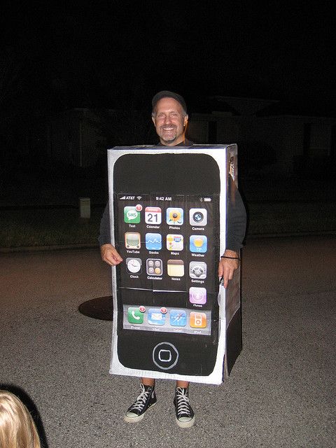 a man is holding up an iphone costume