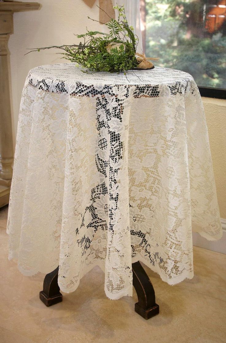 Bring a touch of elegance and sophistication to your vintage inspired event or home decor with this Ivory Lace Round Tablecloth. This beautiful tablecloth features a classic floral pattern and lovely scalloped edges. Pair this ivory round table cloth with burlap and antique style glass accessories for an intimate outdoor dinner; or incorporate it into your lavish wedding tabletop settings with candle vases and fresh flowers. Perfect for a retro-inspired wedding, dinner party, or farmhouse style holiday table!  This gorgeous tablecloth is ﻿﻿60" in diameter.    The best way to clean this tablecloth is by hand washing it with a mild detergent in cold water. Avoid using force to scrub at the material; as it can damage the delicate fabric. After washing, don't wring out the excess water, instea Dinner 2023, Dance Decor, Taylor Wedding, Wedding Tablescape, Vintage Inspired Decor, July Wedding, Lace Table, Vintage Wedding Decorations, Lace Tablecloth