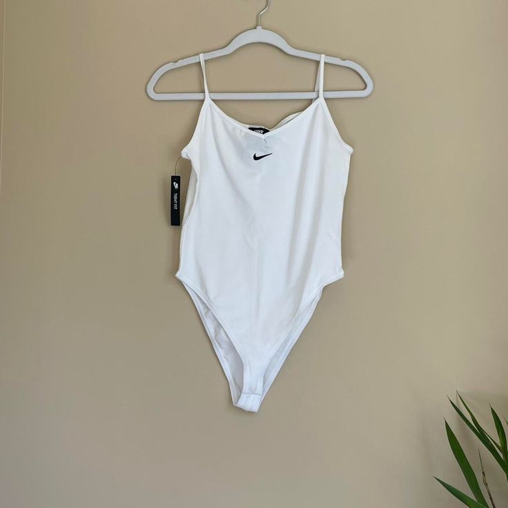 - New With Tags - 92% Cotton - 8% Spandex Nike Swimwear For Spring Swimming, Spring Nike Swimwear For Swimming, Nike Spring Swimwear For Swimming, White Workout Bodysuit For Summer, Nike Fitted Bodysuit, Nike Stretch Bodysuit For Beach, Nike One-piece Swimwear For Summer, Nike Casual Bodysuit For Summer, Nike Casual Summer Bodysuit