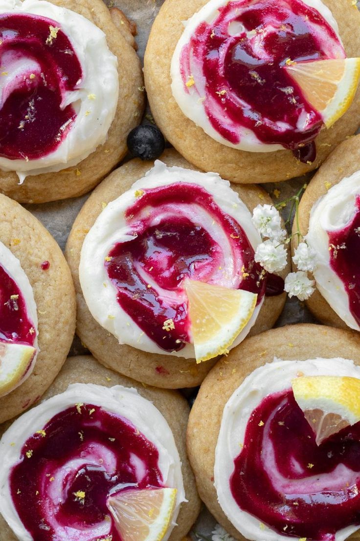 some cookies with lemon slices and jam on them