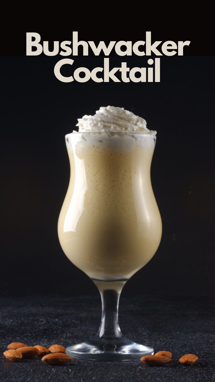 a drink in a glass with whipped cream on top