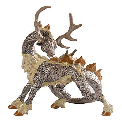 a statue of a dragon with antlers on its back