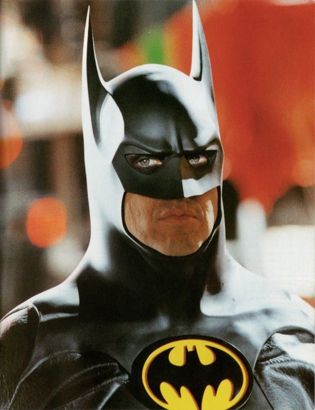 the batman movie poster is shown in full color and has a black mask with yellow lettering on