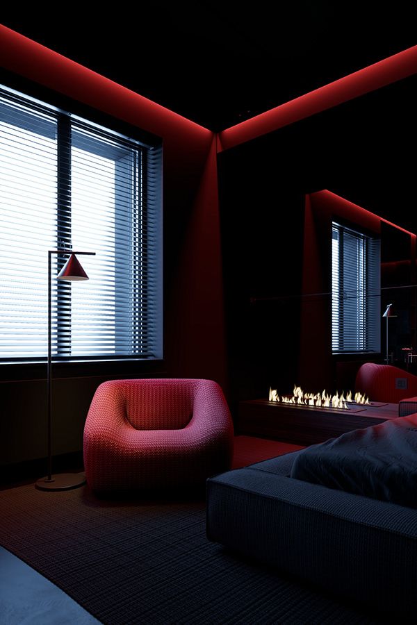 a bedroom with red lighting and a bed in front of a window that is lit up