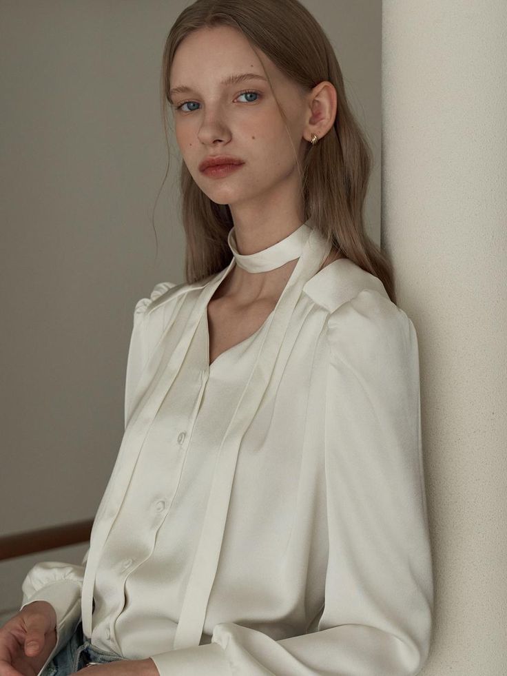 This is a feminine and modern blouse by JOORTI that is made out of high quality and sturdy material. With distinctive mood of the design and comfortable wear, you can style it for your clean and stylish daily outfit.- Wide shoulder panel- V neckline and pin tuck detail- Tie for various styling Chic White Blouse With Tie Sleeves, White Tie Sleeves Blouse For Office, Elegant Cream Office Tops, Elegant Beige Office Blouse, Elegant Beige Tie Neck Blouse, Elegant Beige Blouse For Office, Feminine Beige Blouse For Office, Feminine Tie Neck Blouse For Office, Elegant Tie Neck Top For Office Wear