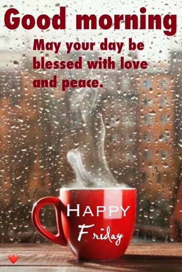 a red coffee cup sitting on top of a wooden table next to a rainy window