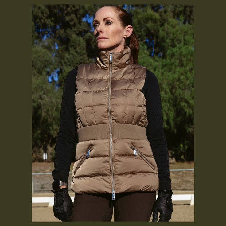 We're obsessed with the Maeve Quilted Vest! Made with water resistant, satin-like, insulated fabric to keep you warm and dry design features include: Contrast waistband provides a super flattering silhouette. Inner stretch cuffs. Custom diamond quilting. Features: Double Zippers Logo embroidery on chest Zip Pockets Care Instructions: Machine Wash Cold, Delicate Cycle, Dry Flat, Do Not Bleach Available in Champagne & Black Fitted Nylon Outdoor Outerwear, Fitted Nylon Outerwear For Outdoor, Fitted Nylon Outerwear With Fleece Lining, Fitted Waterproof Nylon Outerwear, Fitted Waterproof Outerwear For Winter Sports, Waterproof Fitted Outerwear For Winter Sports, Waterproof Fitted Nylon Outerwear, Quilted Puffer Vest, Quilted Vest