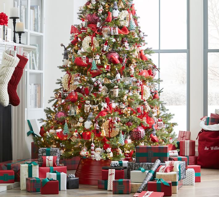 a decorated christmas tree with presents under it