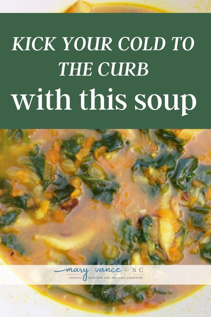 a white bowl filled with soup next to a green sign that says kick your cold to the curb with this soup