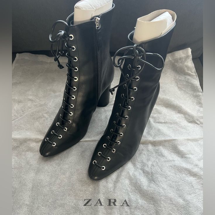 Black Leather Heeled Ankle Boots Nwot Size: Us 7.5/Eu 38 Never Worn Leather Upper Front Laces With Thirteen Pairs Of Metal Eyelets Round Lined Heel Almond-Shaped Toe Inner Side Zip Closure Sole Height: 3.5” (9cm) 5127/001/040 Winter Workwear Lace-up Boots With Pointed Toe, Chic High Heel Lace-up Boots For Fall, Elegant Lace-up Mid-calf Boots For Fall, Designer Ankle Lace-up Boots For Fall, Designer Lace-up Ankle Boots For Fall, Elegant High Heel Lace-up Boots For Fall, Pointed Toe Lace-up Boots With Reinforced Heel For Fall, Lace-up Evening Boots For Fall, Winter Lace-up Boots With Leather Sole And Pointed Toe