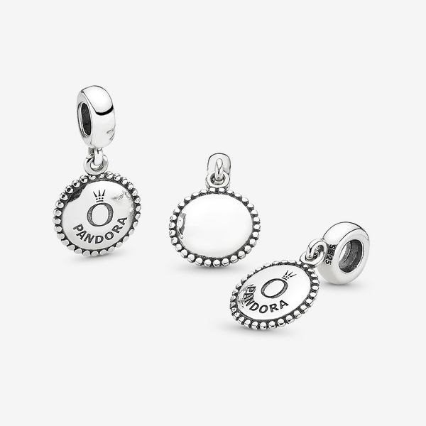 An elegant way to wear the logo trend, it's stamped with our brand name and crown O monogram making it the perfect piece for Pandora lovers. You can also try wearing it as a necklace pendant, displaying the front or back to suit your mood. - Pandora Icon Dangle Charm - Sterling silver Elegant Silver Charms For Everyday, Classic Charms For Everyday, Elegant Logo Charm Pendant, Elegant Pendant Charms With Logo, Everyday Silver Jewelry With Logo Charm, Elegant Pendant Logo Charm, Personalized Silver Elegant Charms, Elegant Sterling Silver Charms For Everyday, Classic Everyday Sterling Silver Charms