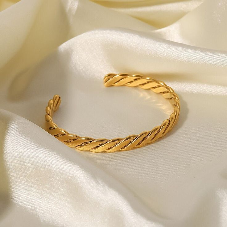 The Twisted Open Cuff Bracelet, featuring a unique 18k gold-filled twist design, offers a contemporary take on classic elegance. Its open style makes it a versatile and stylish addition to any jewelry collection. Cuban Chain Bracelet, Open Design, Cuban Chain, Chain Bracelet, Cuff Bracelet, Cuff, Stainless Steel, Bracelet, Chain