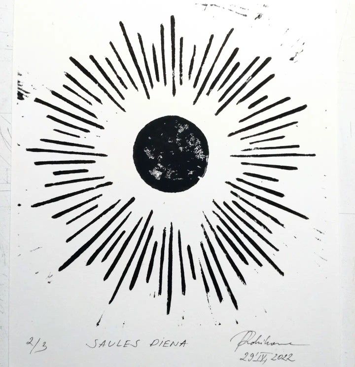 a black and white drawing of the sun